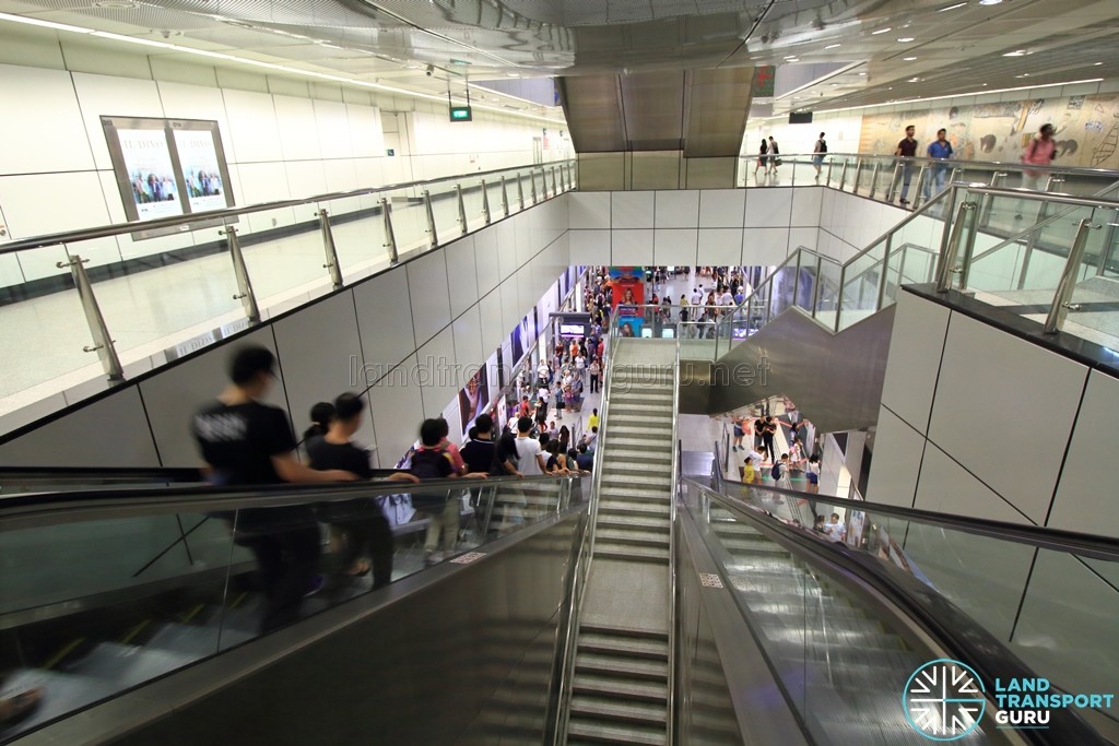 Dhoby Ghaut MRT Station - NEL Transfer Hall at B3, with long escalators descending to platform level at B5