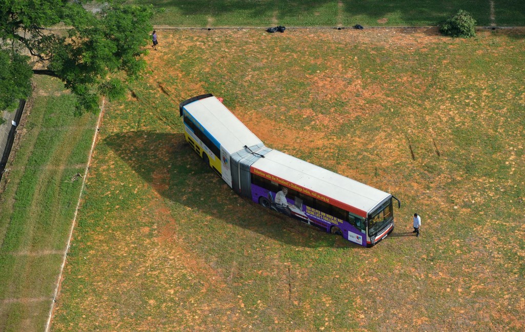 SMRT Bus stuck in the field. ST PHOTO: ALPHONSUS CHERN