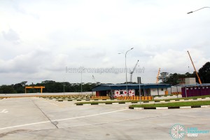 Seletar Bus Depot (Bus Park), with container offices under a metal roof and portable toilets