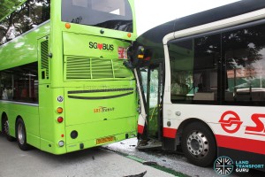 Side view of accident. The front door of the SMRT bus has been knocked out of position.