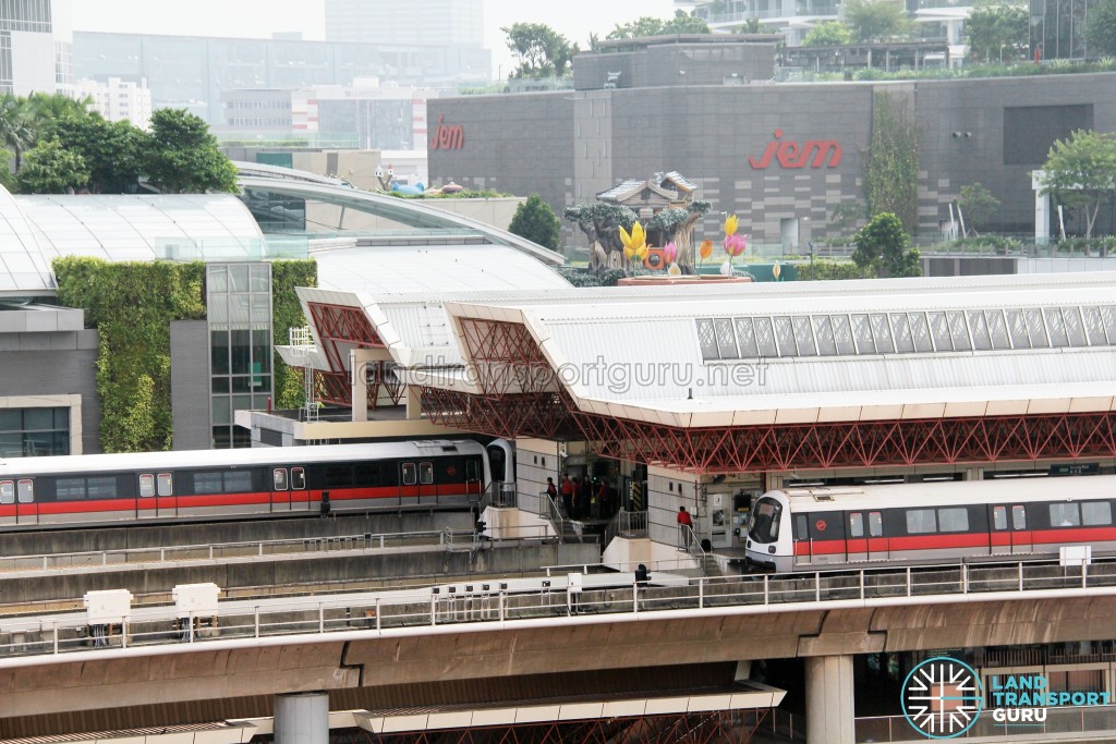 SMRT C151 train sets 027/028 and 037/038 coupled together at Jurong East Station