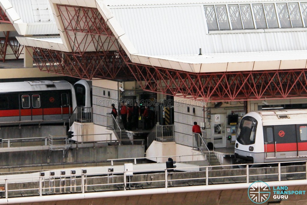 SMRT C151 train sets 027/028 and 037/038 coupled together at Jurong East Station