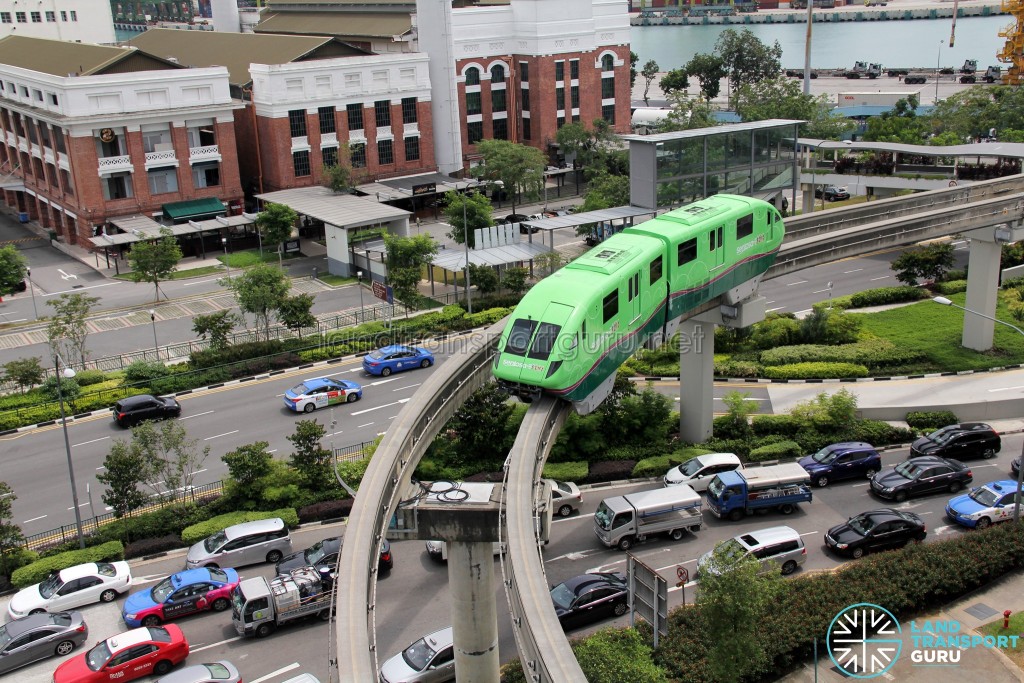 Sentosa Monorail train entering Vivocity station, with St James Power Station in the background