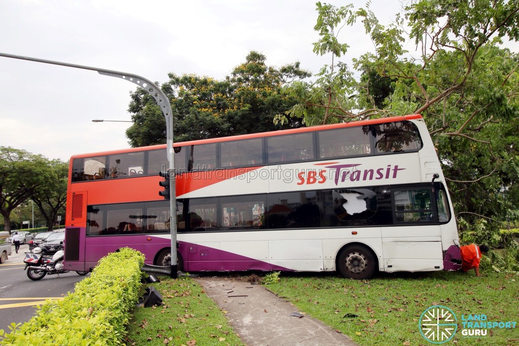 Side view of accident bus, with damaged panels evident