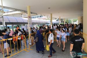 Commuters queue for Shuttle buses at Aljunied during the Full Day Closure