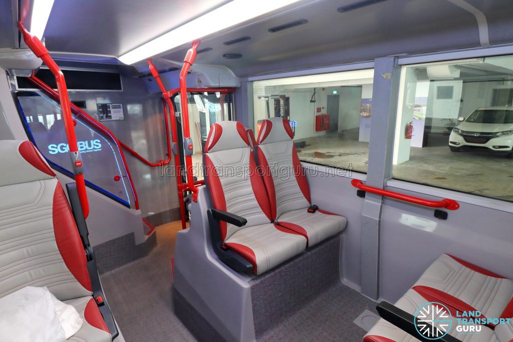 ADL E500 3-Door Concept Bus - Rear facing seats with condensate pipe along wall pillar